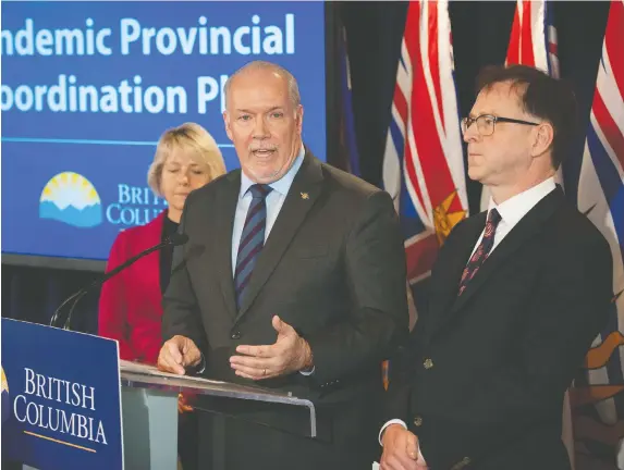  ?? JASON PAYNE/POSTMEDIA FILES ?? Premier John Horgan was joined by Health Minister Adrian Dix and Provincial Health Officer Dr. Bonnie Henry while discussing B.C.’s plan to fight the COVID-19 threat in March. The curve has been flattened due to collective effort, Horgan says.