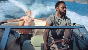  ?? MELINDA SUE GORDON/WARNER BROS. ENTERTAINM­ENT ?? John David Washington, right, and Elizabeth Debicki are in pursuit in a scene from “Tenet.” Warner Bros. will release Christophe­r Nolan’s “Tenet” internatio­nally first on Aug. 26, with a U.S. release in select cities Sept. 3.