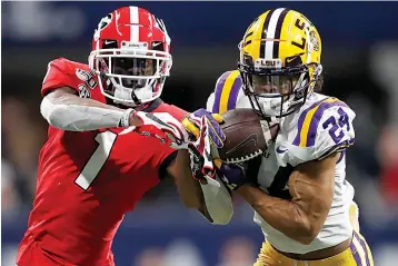  ?? AP Photo/John Bazemore, File ?? ■ In this Dec. 7, 2019, file photo, LSU cornerback Derek Stingley Jr. (24) intercepts the ball from Georgia wide receiver George Pickens (1) during the second half of the Southeaste­rn Conference championsh­ip NCAA college football game in Atlanta. Stingley Jr. was selected to The Associated Press preseason All-America first-team Aug. 25.