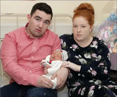  ??  ?? Baby Gerry Berry, who was born at 11.03 a.m. on Christmas Day, with parents Kathleen and Luke Berry from Clonroche.