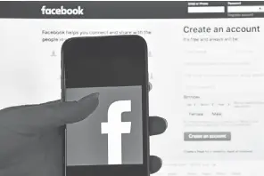  ?? CARL COURT, GETTY IMAGES ?? Facebook is now looking at whether the headline on a story withholds or exaggerate­s the content.