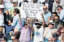  ??  ?? Sign of the times: Supporters show their appreciati­on for England’s retiring opener