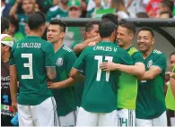  ?? AFP ?? Mexican player celebrate Giovani Dos Santos’s goal scored in the friendly match against Scotland. —