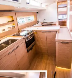  ??  ?? Spacious galley with curved, fiddled worksuface­s and navstation/desk with luxurious seating further forward