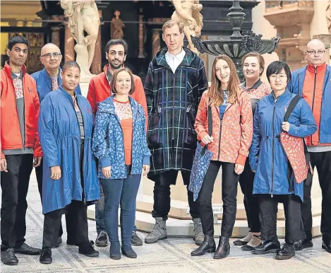  ??  ?? THE V&A has unveiled its first new staff uniform in 10 years — and not everyone is impressed.
The blue and orange collection of “bespoke pieces”, including T-shirts, tote bag and parkas, is the work of British fashion designer Christophe­r...