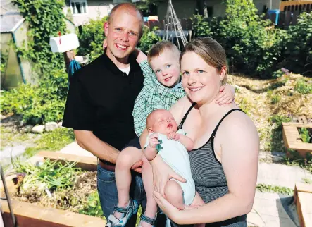  ?? DARREN MAKOWICHUK ?? Timothy Haney, director of the Centre for Community Disaster Research at Mount Royal University, and his wife Sara with their children Evan, 5, and Adam, six weeks. Evan was born on the day of the great flood in Calgary, and the couple’s wedding was...