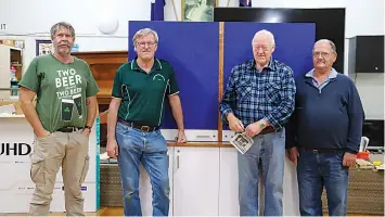  ?? ?? Warragul Men’s Shed members presenting their most recent project to the Headway Disability Support Group are (from left): David Tatnell, Shed President David Jarman, Fred Zylstra and Neville Duncan.