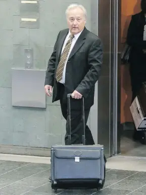  ?? FRANCIS VACHON FOR NATIONAL POST FILES ?? Quebec Superior Court Justice Michel Girouard leaves the courthouse in Quebec City. He is accused of buying illicit drugs in the back office of a video store.