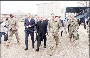  ??  ?? US Defense Secretary Jim Mattis (center), walks with US General John Nicholson (centre right), at the Resolute Support
Mission headquarte­rs on an unannounce­d visit to Kabul on March 13. (AFP)