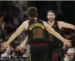  ?? TONY DEJAK - THE ASSOCIATED PRESS ?? Cleveland Cavaliers’ Kevin Love, right, and Matthew Dellavedov­a celebrate after Love made a threepoint shot in overtime in an NBA basketball game against the San Antonio Spurs, Sunday, March 8, 2020, in Cleveland. The Cavaliers won 132-129 in overtime.
