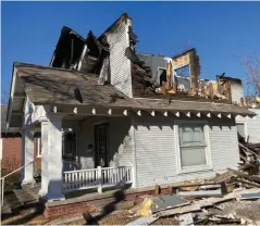  ??  ?? This house on Olive Street was damaged in a fire. (Pine Bluff Commercial/Byron Tate)