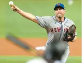  ?? SLADKY/AP LYNNE ?? Mets starting pitcher Max Scherzer throws to the Marlins’ Jorge Soler during the second inning Thursday in Miami.