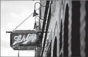  ??  ?? A neon Schlitz sign hangs on the exterior of Schubas Tavern, formerly a Schlitz Brewery, in Chicago.