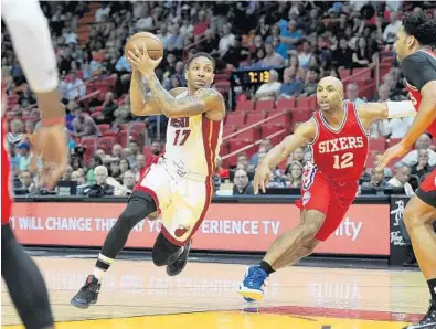  ?? MICHAEL LAUGHLIN/STAFF PHOTOGRAPH­ER ?? The Heat’s Rodney McGruder drives down the middle of the Philadelph­ia 76ers defense during the first half Wednesday in Miami.