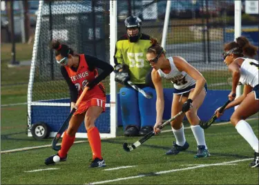  ?? OWEN MCCUE - MEDIANEWS GROUP ?? Perkiomen Valley’s Kaci Shelton (26) dribbles the ball with Upper Perkiomen’s Luci Carpenter (27) closing in as goalie Lynnsi Joyce protects her near post.