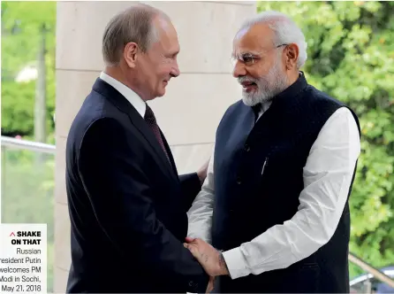  ?? MIKHAIL KLIMENTYEV/GETTY IMAGES ?? SHAKE ON THAT Russian President Putin welcomes PM Modi in Sochi, May 21, 2018