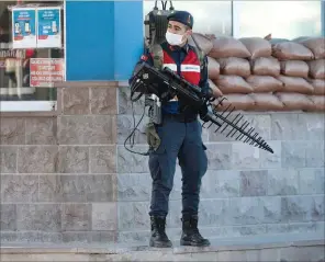  ?? (AFP) ?? A Turkish soldier patrols next to the entrance of the Sincan Penal Institutio­n at the 4th Heavy Penal Court near Ankara, on Thursday.