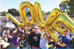  ??  ?? SYDNEY: Supporters of the same-sex marriage ‘Yes’ vote gather to celebrate the announceme­nt in a Sydney park yesterday. —AFP