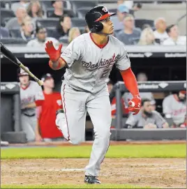  ?? Bill Kostroun ?? The Associated Press Washington Nationals outfielder Juan Soto tosses his bat after hitting a home run against the New York Yankees in the seventh inning on Wednesday at Yankee Stadium.