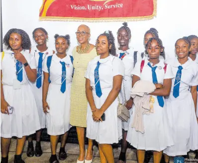  ?? CONTRIBUTE­D PHOTOS ?? Minister of Education and Youth Fayval Williams, shares a moment with students from the all-girls Mount Alvernia High School in Montego Bay, St James, at a ‘Rapping with the Minister’ forum held at Jamaica College, St Andrew, on Tuesday.
