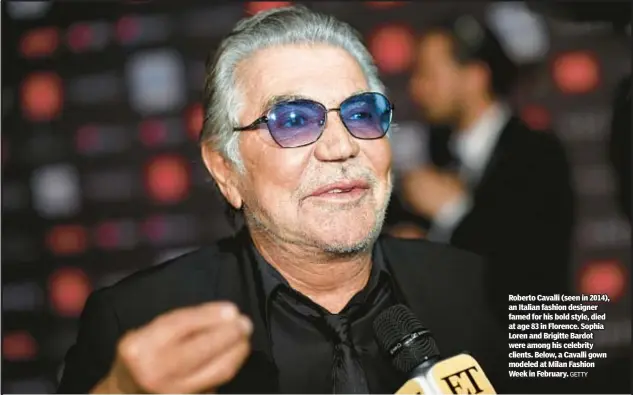  ?? GETTY ?? Roberto Cavalli (seen in 2014), an Italian fashion designer famed for his bold style, died at age 83 in Florence. Sophia Loren and Brigitte Bardot were among his celebrity clients. Below, a Cavalli gown modeled at Milan Fashion Week in February.