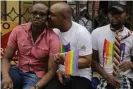  ??  ?? LGBT activists and their supporters await the ruling outside court in Nairobi on Friday morning. Photograph: Khalil Senosi/ AP