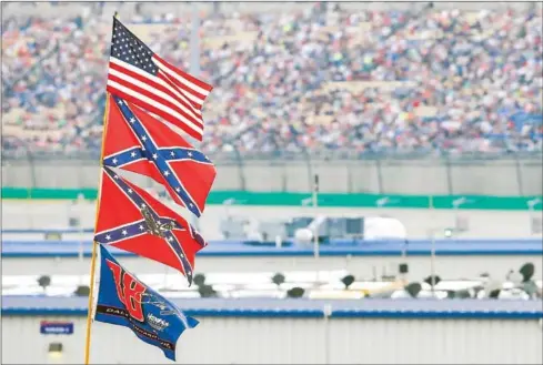  ?? GETTY IMAGES/AFP ?? The ‘Rebel Flag’ has long been a staple of Nascar spectators and events, but that is about to end.