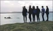  ??  ?? Pupils visit the site of the sinking of the Iolaire.