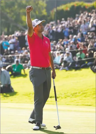  ?? [RYAN KANG/THE ASSOCIATED PRESS] ?? Adam Scott reacts after finishing his final-round 70 to win the Genesis Invitation­al at Riviera Country Club. Scott finished at 11-under 273 and moved to No. 7 in the world.