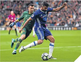  ??  ?? Diego Costa finds the net for Chelsea to seal victory over Hull.