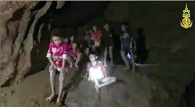  ?? THAI NAVY SEAL VIA AP ?? This screen grab taken from video provided by Thai Navy Seals, shows a view of the boys and their soccer coach as they are rescued in a cave in Chiang Rai in Thailand on July 2, 2018. Rescuers found all the boys and their soccer coach alive deep inside a partially flooded cave in northern Thailand more than a week after they disappeare­d and touched off a desperate search that drew internatio­nal help and captivated the nation.