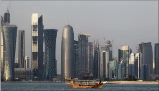  ?? Picture: AP/African News Agency (ANA) ?? UNDETERRED: A traditiona­l dhow floats in the Corniche Bay of Doha, Qatar. A few days into the siege, supreme directives were issued by the Qatari leadership to take the necessary steps to support the industrial sector and move fast towards...