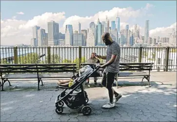  ?? Salvatore Laporta LightRocke­t via Getty Images ?? CORPORATE culture still tends to reward new parents who return to work right away, and most dads can.