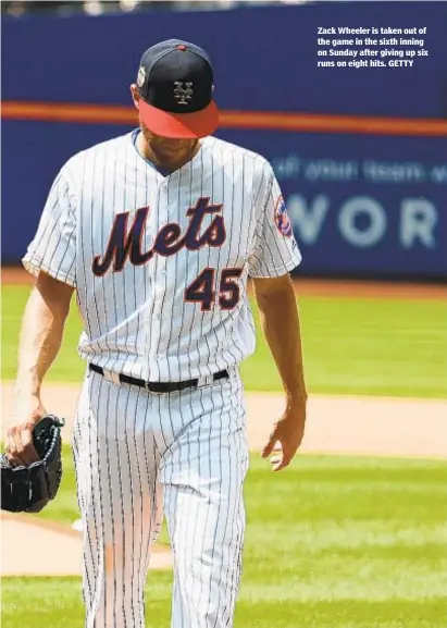  ??  ?? Zack Wheeler is taken out of the game in the sixth inning on Sunday after giving up six runs on eight hits. GETTY