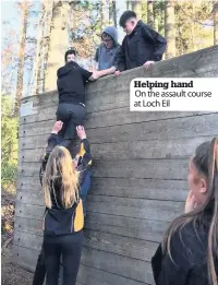  ??  ?? Helping hand On the assault course at Loch Eil