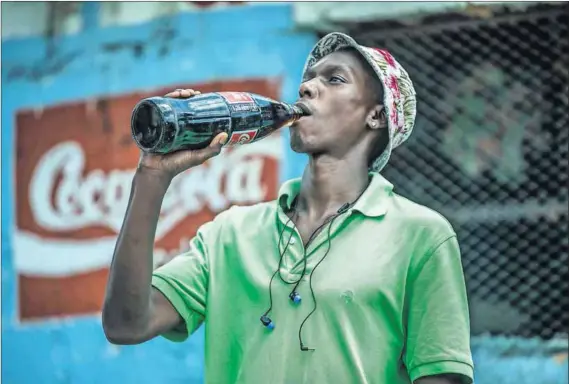  ?? Photo: Mujahid Safodien/AFP ?? Weighty matter: The plan to tax sweet drinks, a bid to cut the cost of noncommuni­cable diseases on citizens and the health system, has been welcomed by some and criticised by others who say a price increase will not reduce obesity.