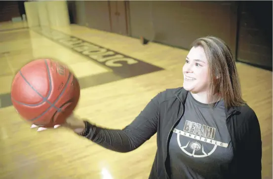  ?? RICKKINTZE­L/THE MORNING CALL ?? Katy Mitton takes a break from preseason practice with the Bethlehem Catholic boys basketball team. The former Parkland High and Muhlenberg College standout is considered the first female to be an assistant coach with a Lehigh Valley boys basketball program.