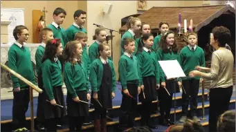  ??  ?? Rahan National School choir with conductor Tina Connolly entertaini­ng at St. Mary’s Church.