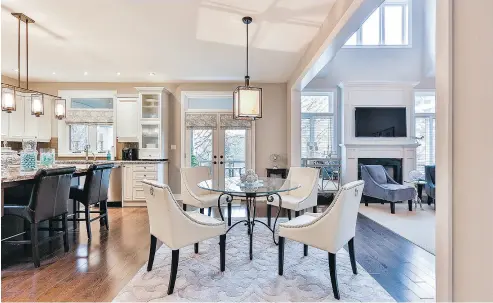  ??  ?? This custom-built home has 14-foot ceilings in the dining room and 17-foot ceilings in the main floor family room.