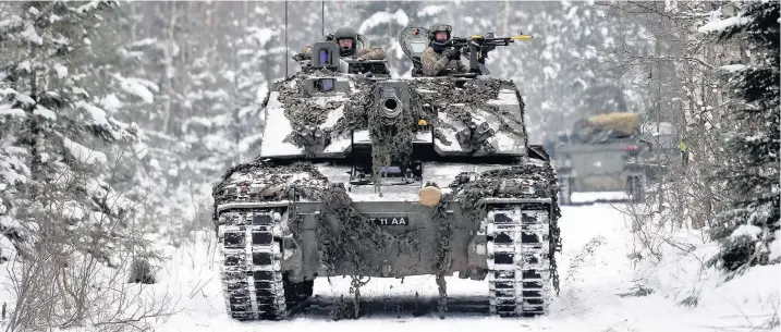  ??  ?? > A Challenger 2 tank at a training area near Tapa in Estonia, as 1st Battalion The Royal Welsh take part in Exercise Winter Camp, where British troops are ‘standing ready’ to defend against a potentiall­y aggressive Russia alongside Nato allies