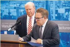  ?? PATRICK SEMANSKY/ASSOCIATED PRESS ?? Environmen­tal Protection Agency Administra­tor Andrew Wheeler, right, signs a document in front of R.D. James, assistant secretary of the Army for civil works, to revoke the Clean Water Rule.