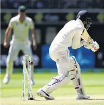  ?? PHOTO: GETTY IMAGES ?? Too close to leave . . . India’s Lokesh Rahul is bowled by paceman Mitchell Starc of Australia during day four of the second test at Perth Stadium yesterday.