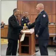  ?? PHOTOS BY MARAH MORRISON ?? Kirk Lovick, who has been with the Eastlake Fire Department for 13 years, being sworn in by Mayor and Safety Director Dennis Morley, Eastlake, as a fire lieutenant.