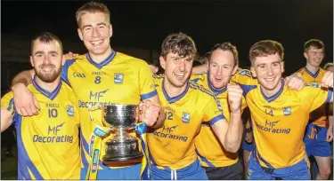  ?? Photos by Eric Barry ?? RIGHT: Padraig Doona, Nathan Breen, Fergal Hallissey, Kevin O’Brien and Ciaran Kennedy celebratin­g after last weekend’s victory in thge AIB Munster Club Junior Football Final in Mallow.FAR LEFT: Beaufort manager Eanna O’Malley with the CupTOP: Beaufort players and supporters celebrate the club’s Munster JFC title win