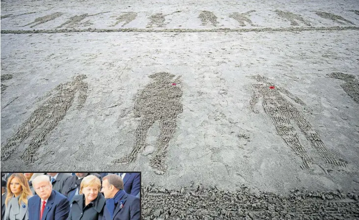  ?? Photo / AP ?? Drawings of soldiers on Sunny Sands Beach, during the Pages of the Sea commemorat­ive event for Armistice Day, in Folkestone, England.