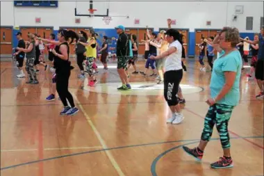  ?? PHOTOS BY LAUREN — HALLIGAN LHALLIGAN@DIGITALFIR­STMEDIA.COM ?? Participan­ts dancing in the second annual Zumbathon Charity Event for the American Diabetes Associatio­n on Sunday at Saratoga Springs High School.