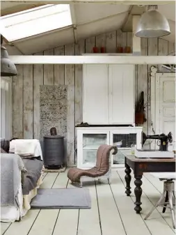  ??  ?? OPPOSITE Huge skylights flood the studio space with light, offsetting the whites and greys of Jo’s upcycled furniture finds THIS PAGE, CLOCKWISE FROM TOP LEFT Vintage metal tankards make stylish holders, keeping cutlery easily accessible; simple...