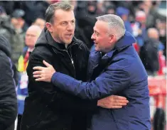  ??  ?? OLD AND NEW: Former Stoke City boss Paul Lambert is greeted by current manager Gary Rowett.