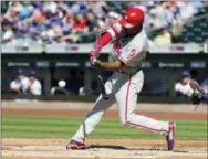  ?? FRANK FRANKLIN II — THE ASSOCIATED PRESS ?? Phillies rightfield­er Nick Williams smacks a run-scoring single in the first inning of Game 1 Monday at Citi Field in New York.