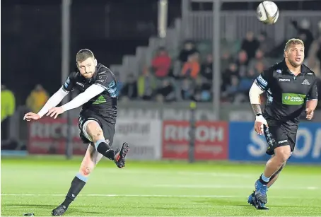  ?? Picture: SNS Group. ?? Finn Russell kicks one of his four penalties in the 17-0 win over Edinburgh at Scotstoun.